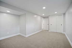 Bedroom with carpet and closet