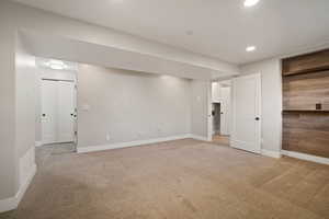 Living Room entrance from garage, access to backyard, and access to 1/2 bath and laundry room