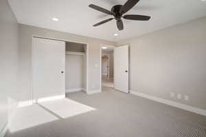 Bedroom with ceiling fan and a closet