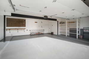 Garage with finished walls/floor, extra wide, storage, workbench and garage door opener