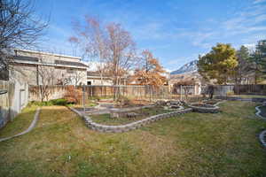 View of landscaped yard and paved rose garden, with view of Mt. Timp