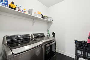 Laundry area featuring separate washer and dryer