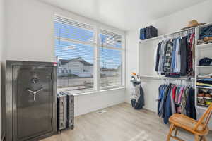 Walk in closet featuring light wood-type flooring