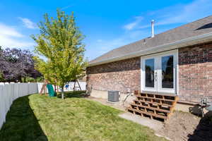 View of yard with central AC unit