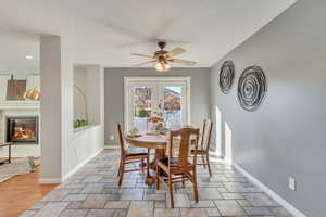 Dining room featuring ceiling fan and french doors