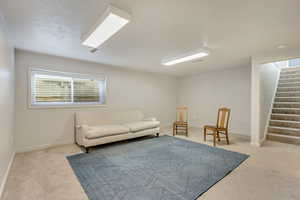 Sitting room with light colored carpet