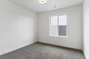 Spare room with carpet floors and a healthy amount of sunlight