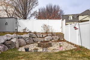 View of yard featuring an outdoor fire pit