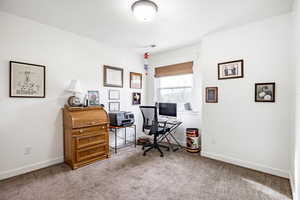 View of carpeted home office