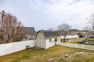 View of yard featuring a storage shed