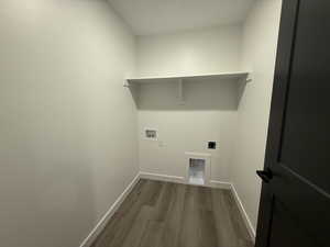 Clothes washing area with hookup for an electric dryer, hookup for a washing machine, and hardwood / wood-style floors