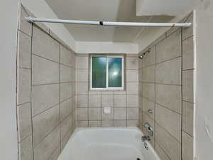 Bathroom featuring tiled shower / bath