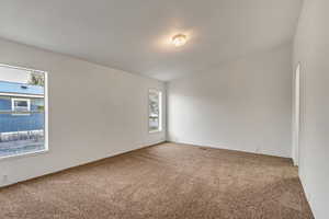 Empty room with carpet flooring