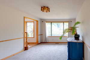 Interior space featuring a textured ceiling