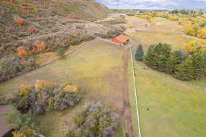 Birds eye view of property with a mountain view and a rural view