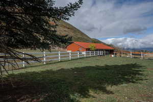 View of yard with a mountain view and a rural view