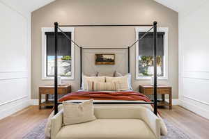 Bedroom featuring vaulted ceiling and light wood-type flooring