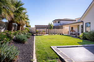 View of yard with a pergola, outdoor lounge area, and a patio