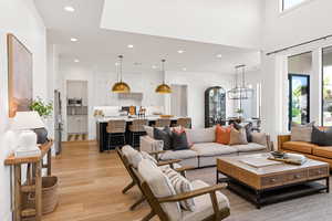 Living room featuring a chandelier and light wood-type flooring