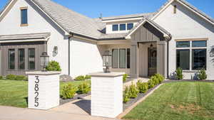 View of front of house with a front yard