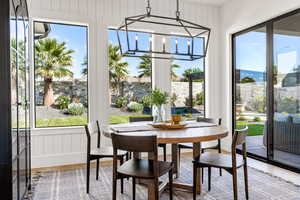 Sunroom with an inviting chandelier