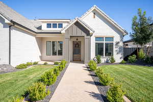 View of front of property with a front yard