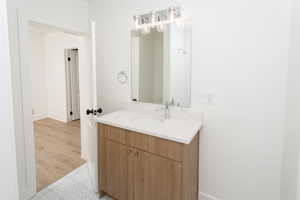 ADU Bathroom featuring all new til flooring, vanity, lighting, etc.