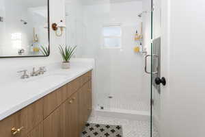 Bathroom featuring all new tile, euro glass doors, new vanity etc.