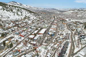 Snowy aerial view with a mountain view