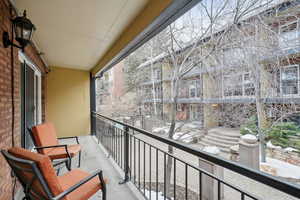 View of snow covered back of property