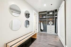 Mudroom with wood-type flooring