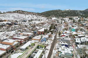 Snowy aerial view featuring a mountain view