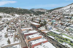 Snowy aerial view with a mountain view