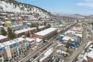 Snowy aerial view featuring a mountain view