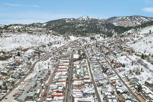 Snowy aerial view with a mountain view