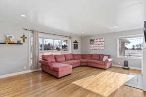 Living room with light hardwood / wood-style floors