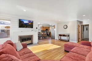 Living room featuring light hardwood / wood-style flooring and a chandelier