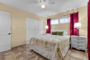 Another view of upstairs bedroom #1 featuring a closet and ceiling fan