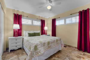 Upstairs bedroom featuring ceiling fan