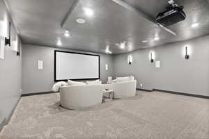 Tiered theatre room with accent lighting.