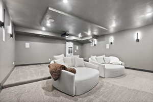 Tiered theatre room with accent lighting.