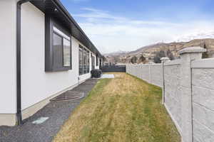 Side view of yard with a mountain view