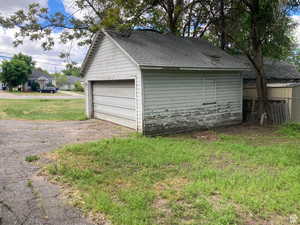 Garage featuring a yard