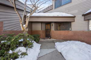 View of snow covered property entrance