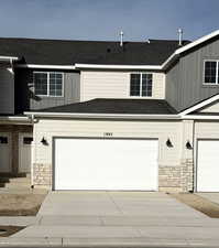 View of front of property featuring a garage