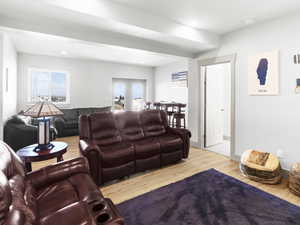 Living room with hardwood / wood-style floors and plenty of natural light