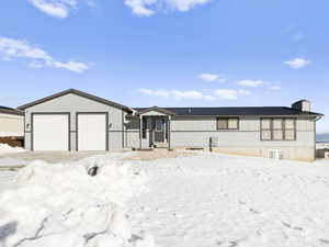 Ranch-style house featuring a garage