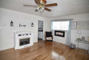 Living area with ceiling fan & hardwood loors