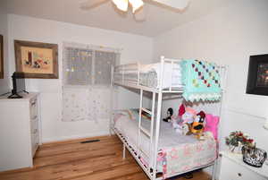 Bedroom#2 featuring wood flooring, new paint and ceiling fan