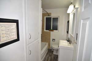 View of main floor bathroom featuring linen closets.